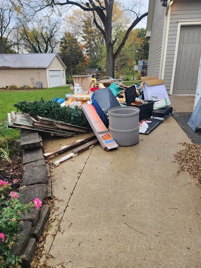 Dumpster being loaded with debris for Commercial Dumpster Rental in Meiners Oaks